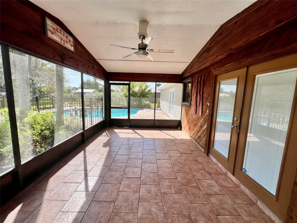 352 Southwest 85th Avenue Okeechobee, FL 34974 - Photo 9 of 21 a view of empty room with wooden floor and fan