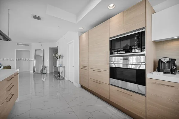 a white toilet sitting next to a shower curtain