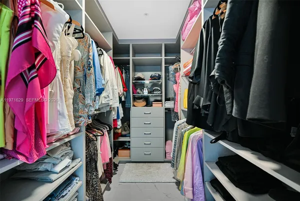 a bathroom with a double vanity sink mirror and shower