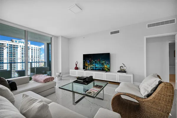 a view of a dining room with furniture and window