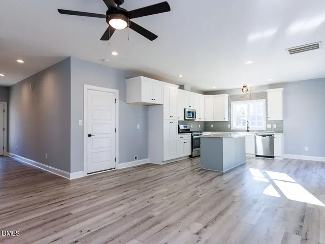 a bathroom with a shower and toilet