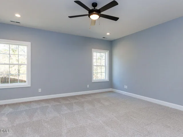 a view of a garage with a bike and wooden roof