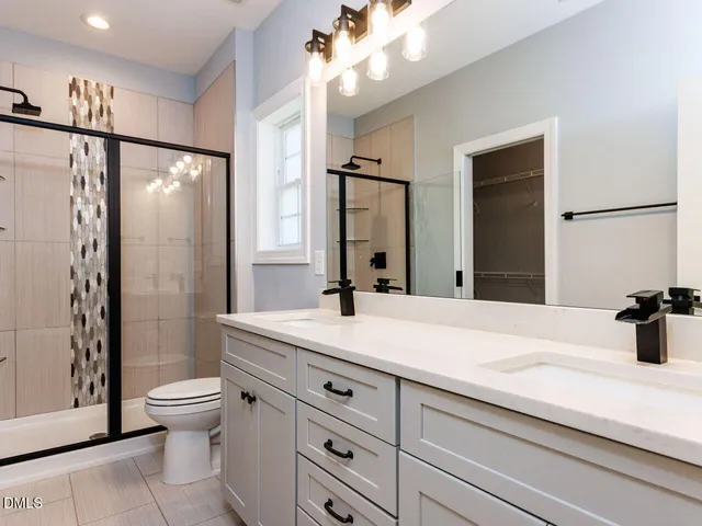 a view of kitchen with microwave a stove and wooden floor