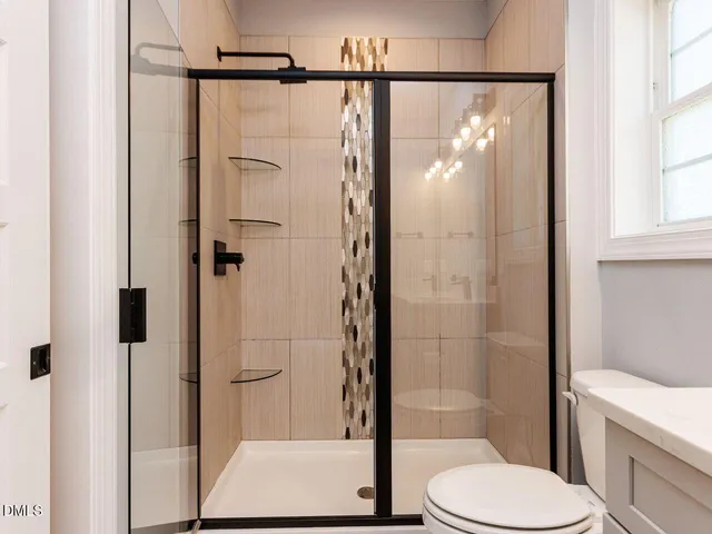 a kitchen with stainless steel appliances a refrigerator sink and microwave