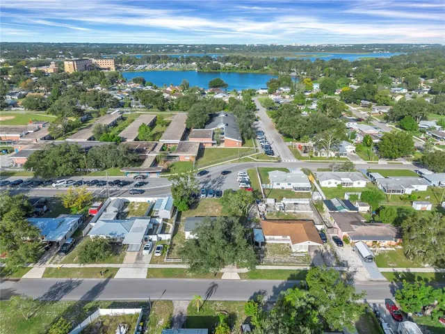 an aerial view of residential building and lake
