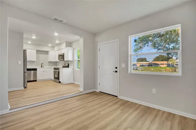 a view of kitchen with wooden floor
