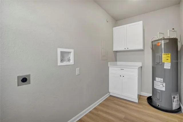 a view of storage and utility room with closet