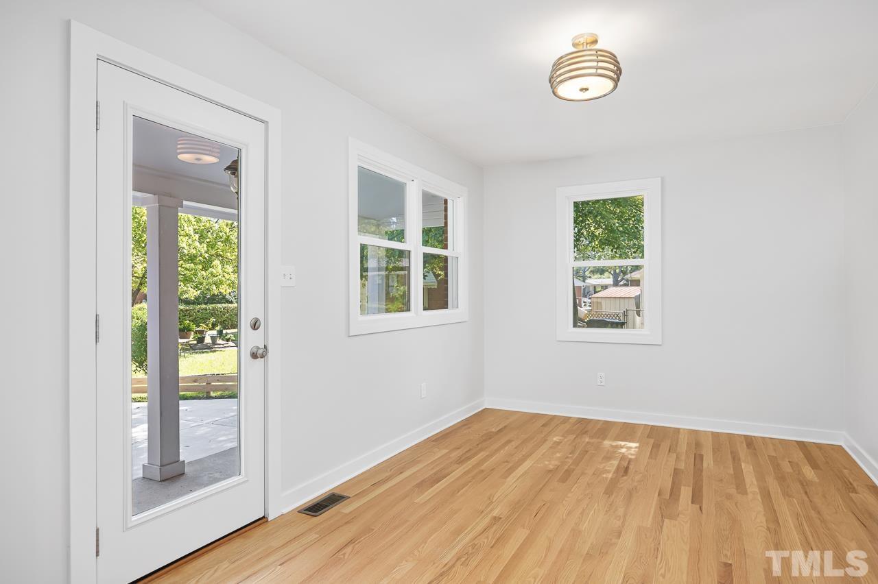 500 Doby Circle Raleigh, NC 27610 - Photo 14 of 40 a view of empty room with wooden floor and fan