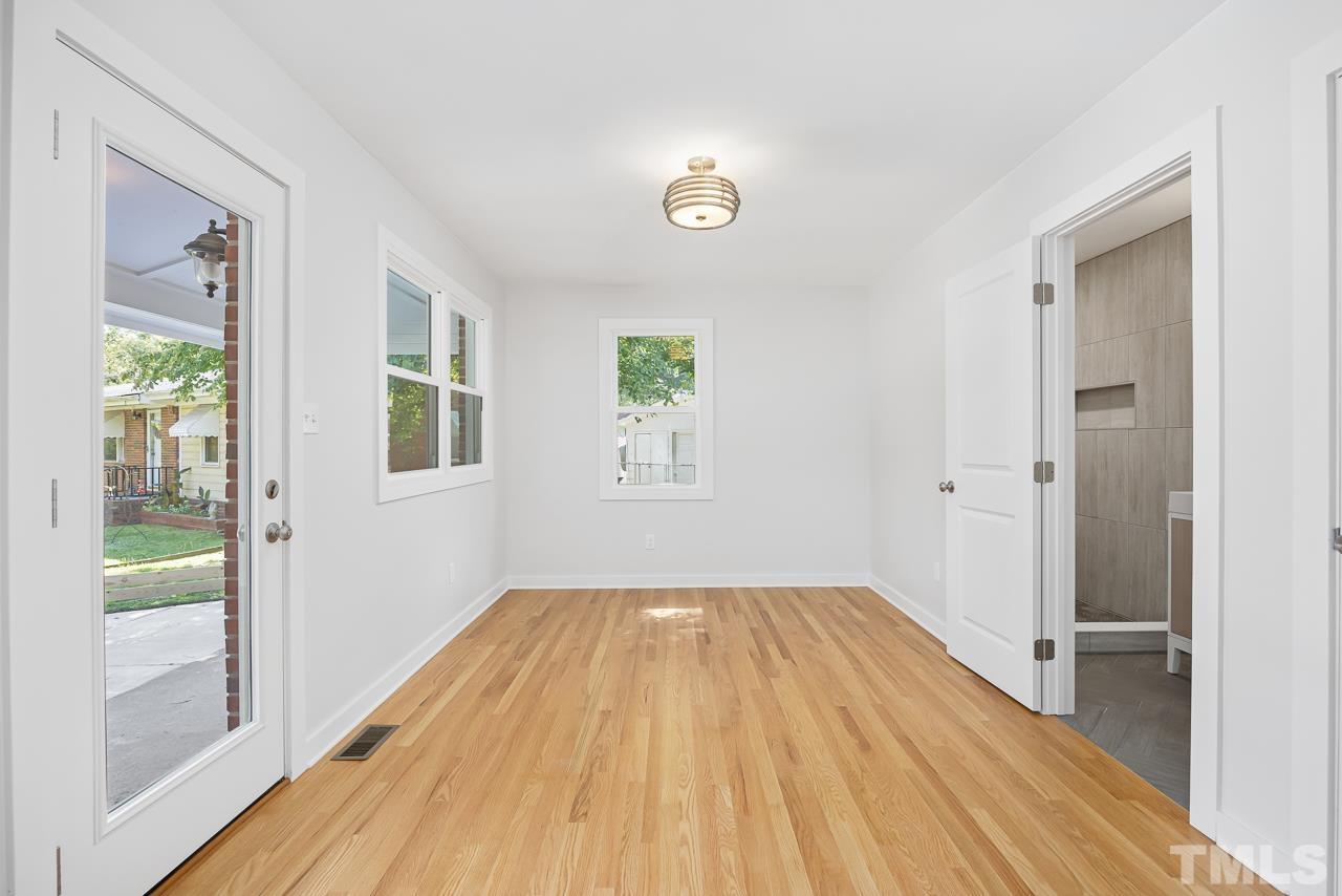 500 Doby Circle Raleigh, NC 27610 - Photo 15 of 40 a view of empty room with wooden floor and fan