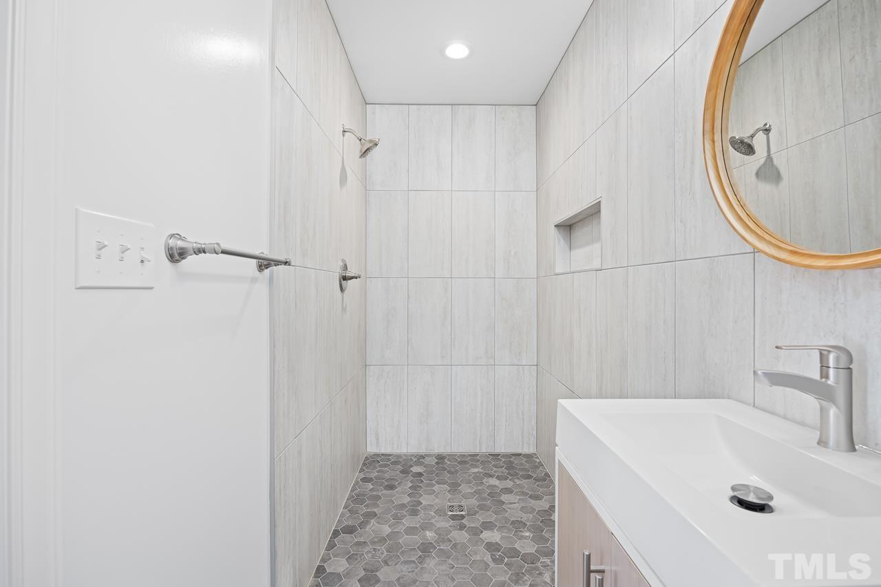 500 Doby Circle Raleigh, NC 27610 - Photo 17 of 40 a bathroom with a sink a toilet and a mirror