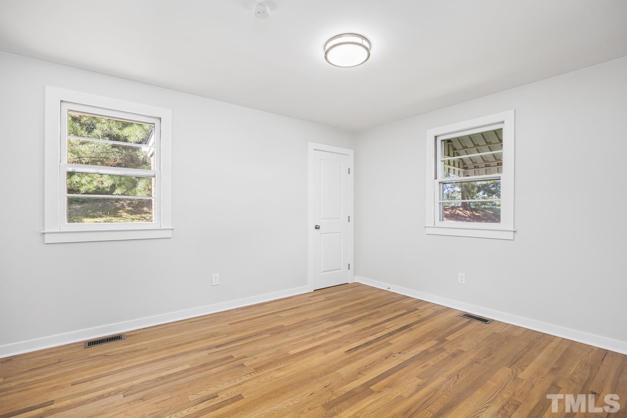 500 Doby Circle Raleigh, NC 27610 - Photo 22 of 40 a view of empty room with wooden floor and fan