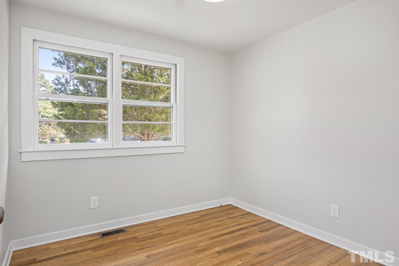 500 Doby Circle Raleigh, NC 27610 - Photo 25 of 40 a view of an empty room with wooden floor and a window