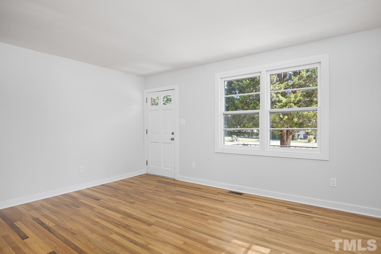 500 Doby Circle Raleigh, NC 27610 - Photo 4 of 40 a view of empty room with wooden floor and fan