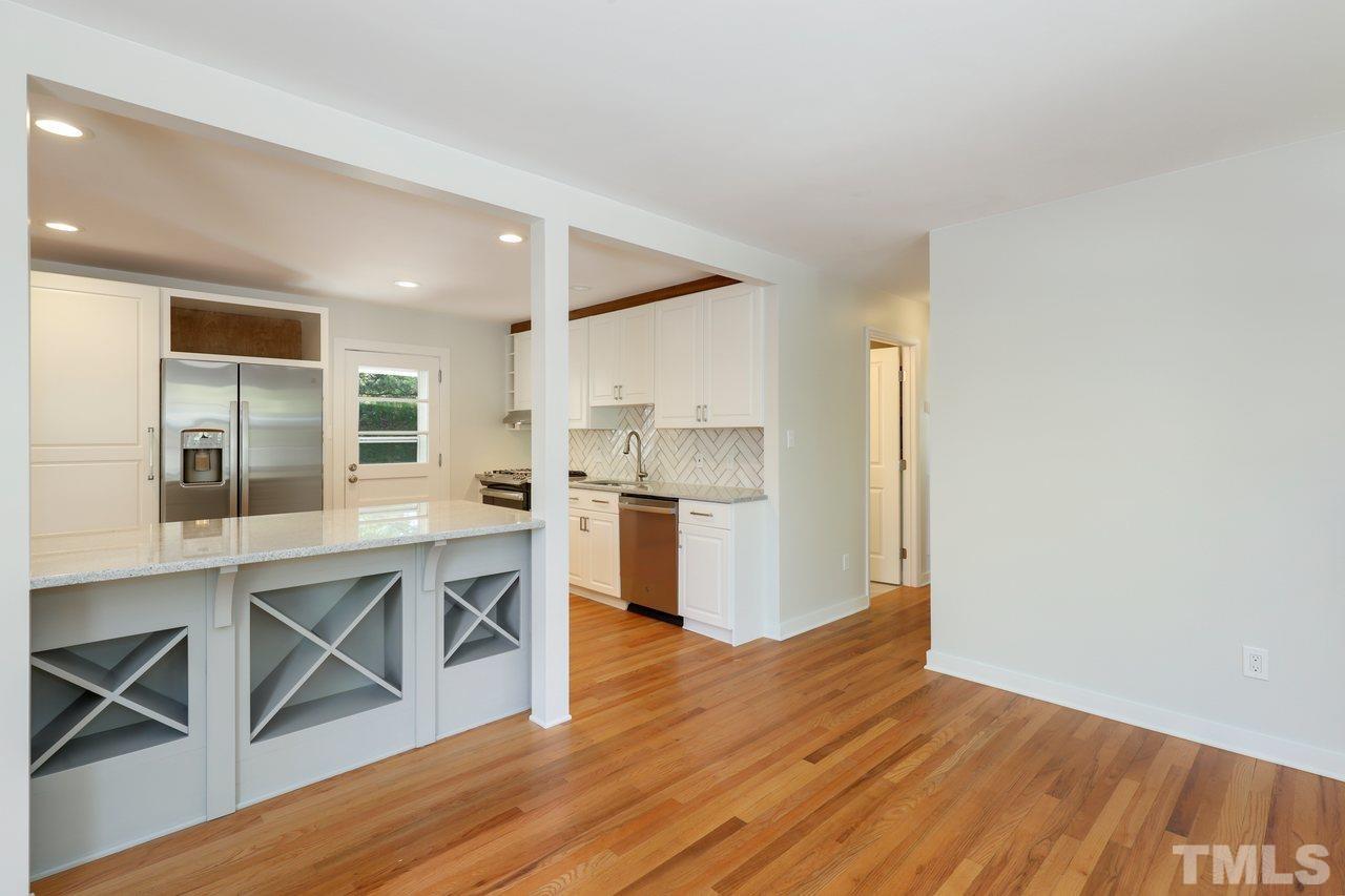 500 Doby Circle Raleigh, NC 27610 - Photo 7 of 40 a kitchen with a wooden floor and a window