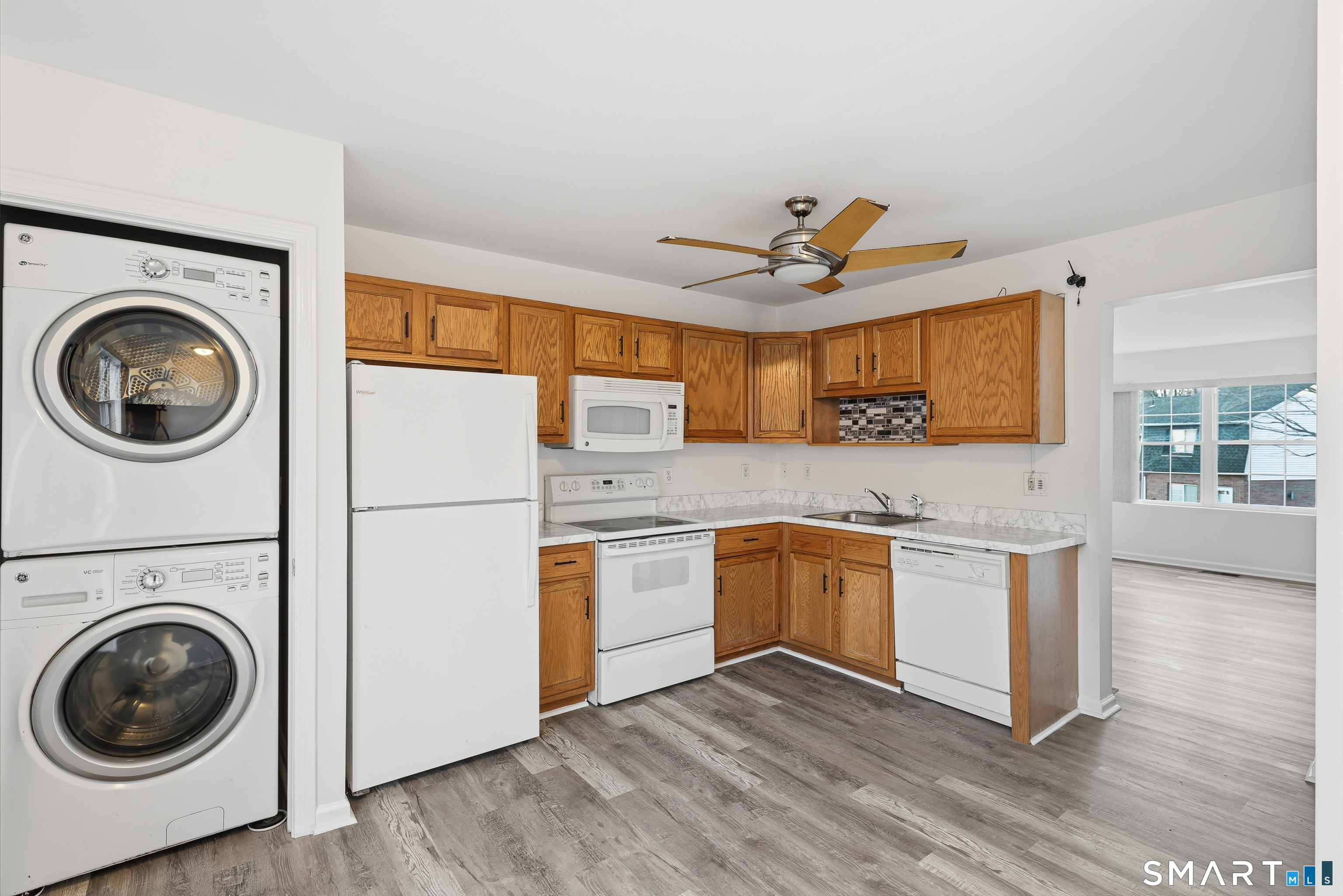 135 Bucks Hill Road, Unit 10 Waterbury, CT 06704 - Photo 5 of 20 a kitchen with stainless steel appliances granite countertop a sink a stove a refrigerator with grey cabinets