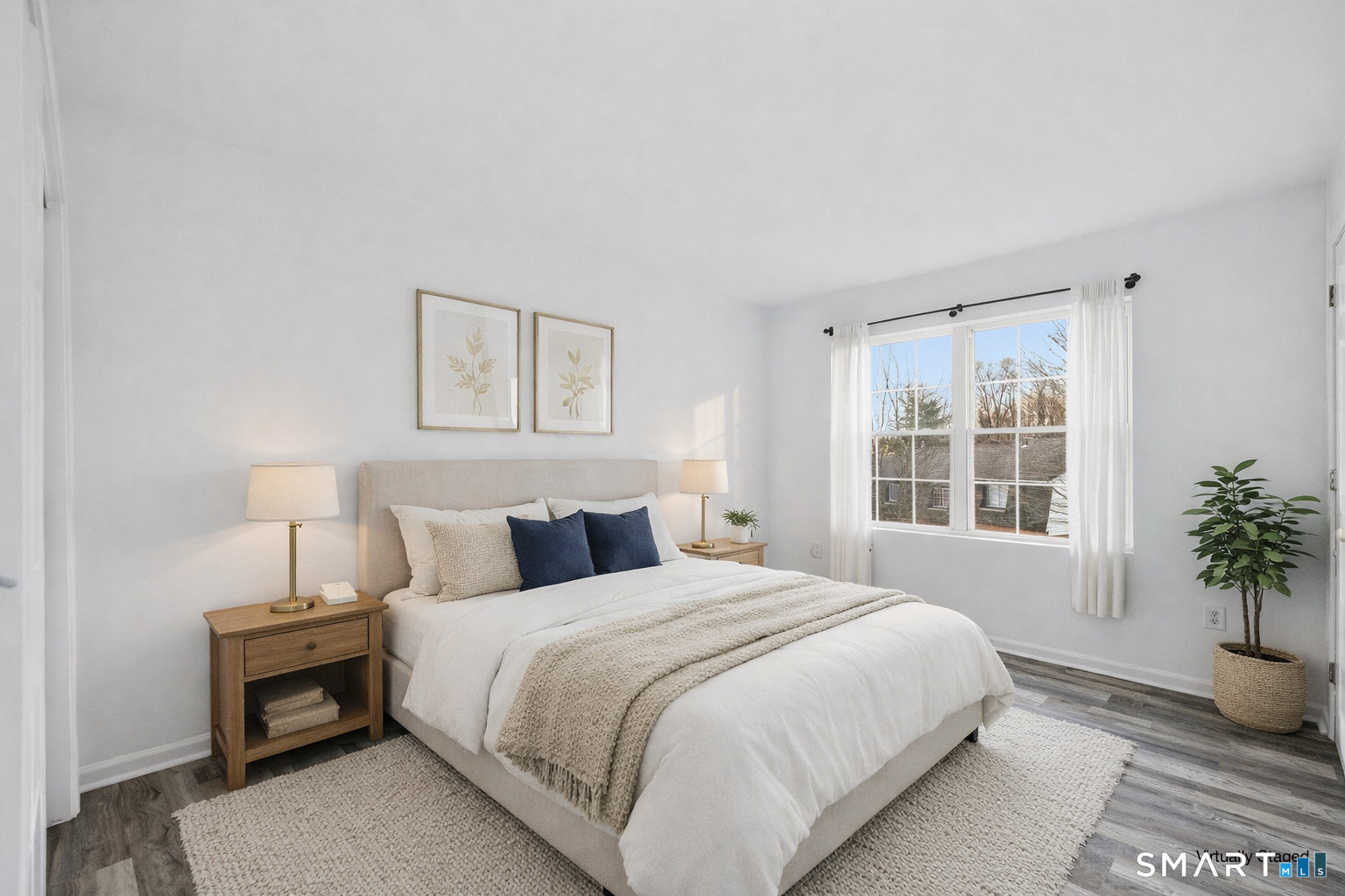 135 Bucks Hill Road, Unit 10 Waterbury, CT 06704 - Photo 8 of 20 a bedroom with a large bed and a potted plant