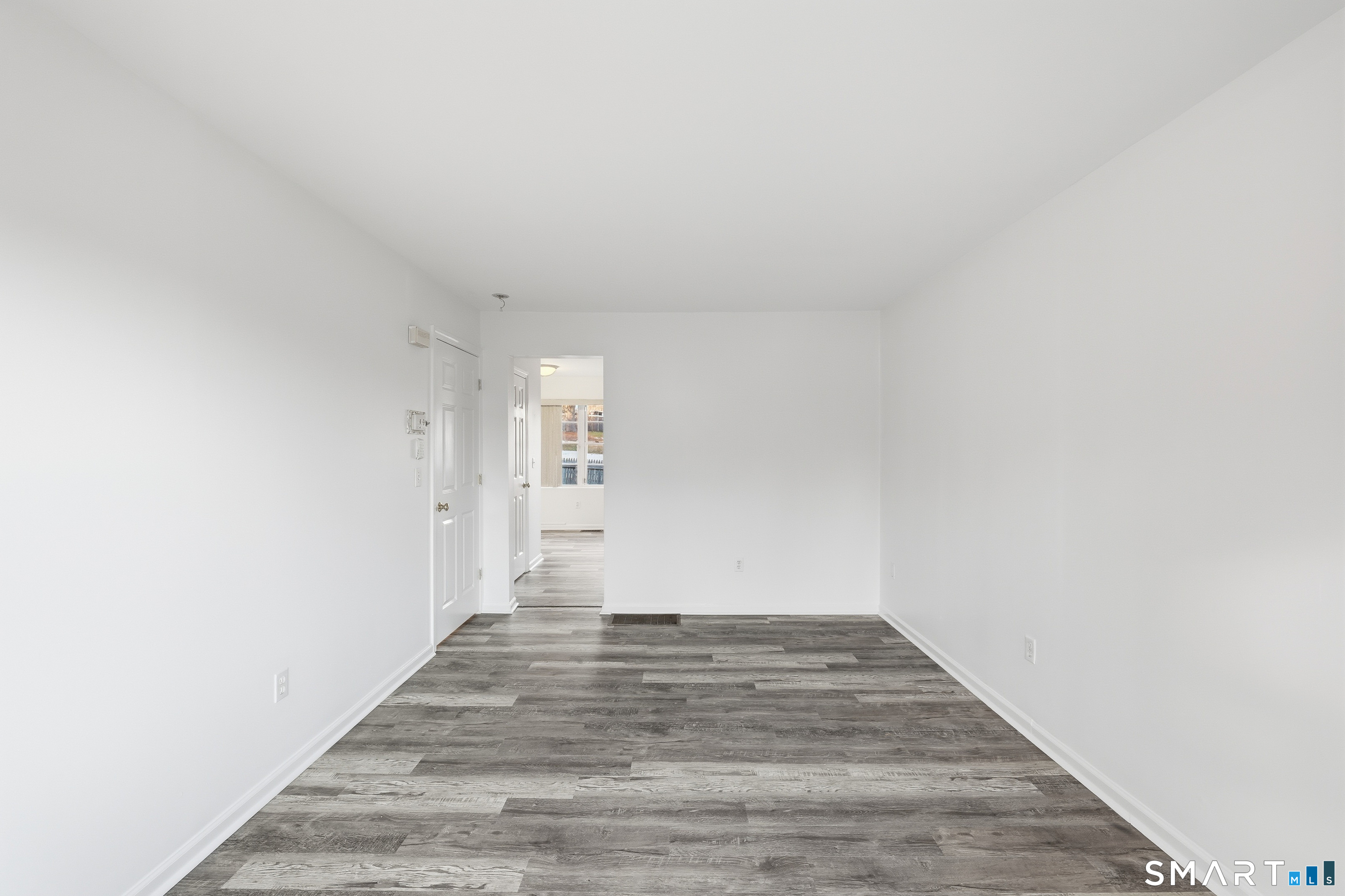 135 Bucks Hill Road, Unit 10 Waterbury, CT 06704 - Photo 10 of 20 a view of a room with wooden floor