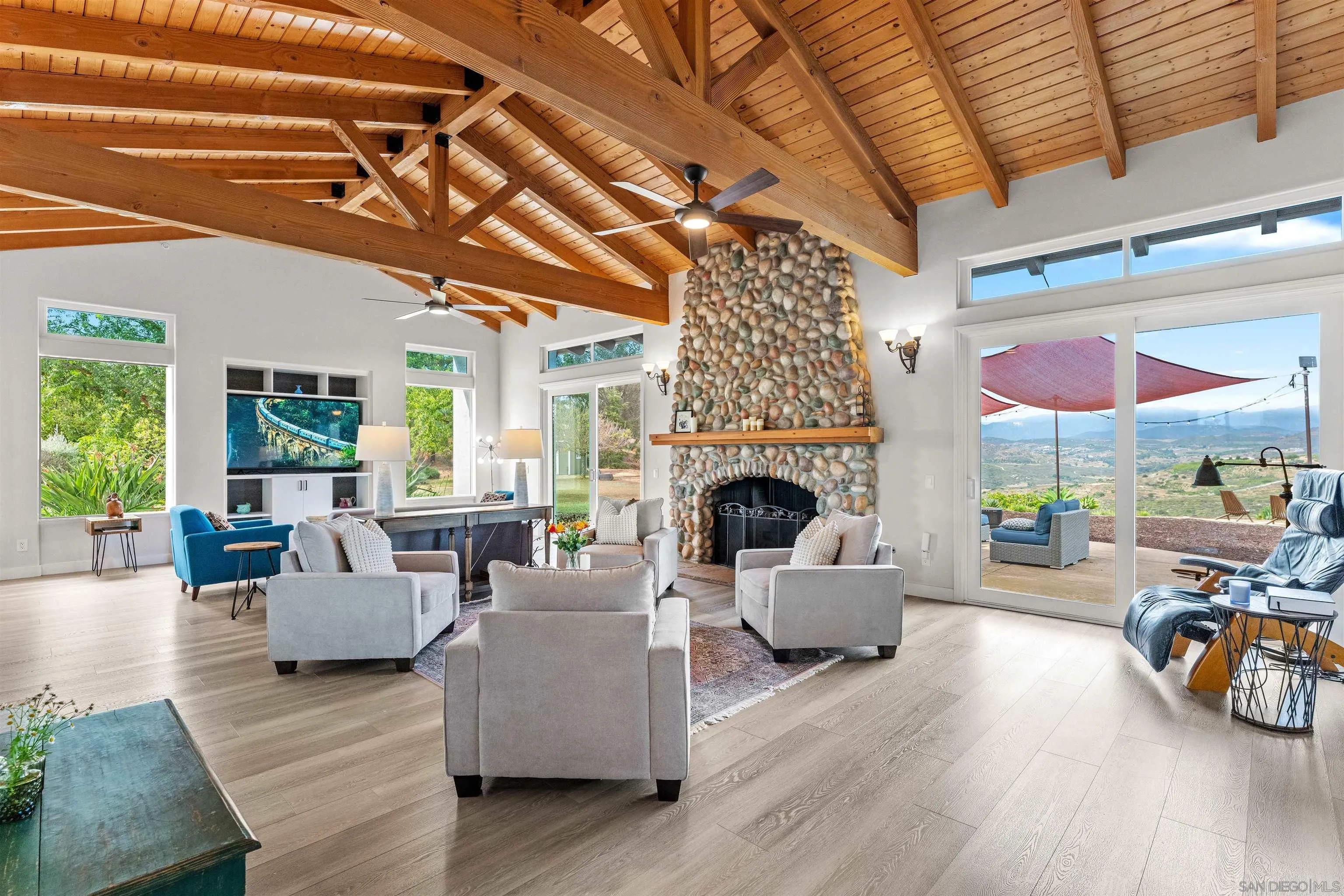 30659 Diaz Road Valley Center, CA 92082 - Photo 24 of 44 a living room with furniture and a fireplace