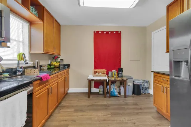 a kitchen with stainless steel appliances granite countertop a stove top oven