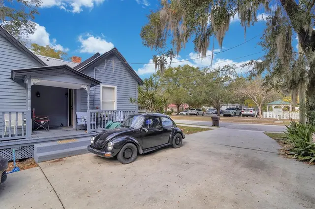 a view of a car parked in front of a house