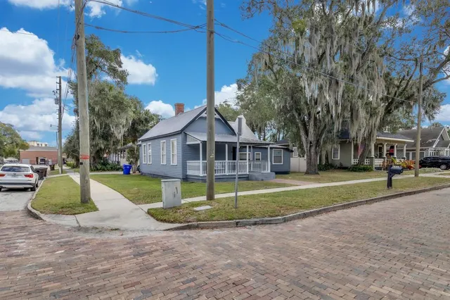 a house with trees in the background