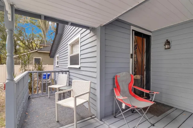 a view of a two chairs in the balcony