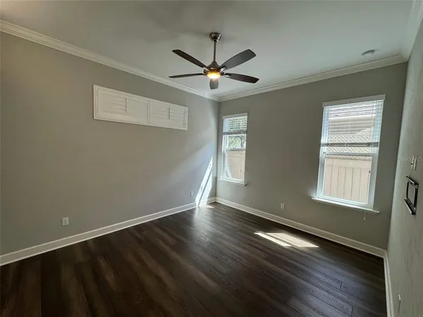 a bathroom with a toilet and a mirror