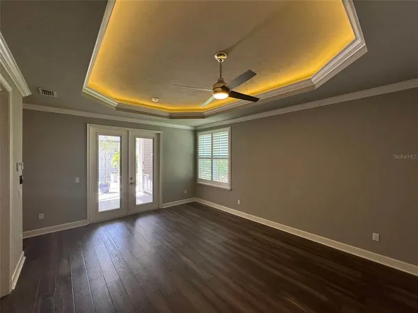 a view of walk in closet with empty racks