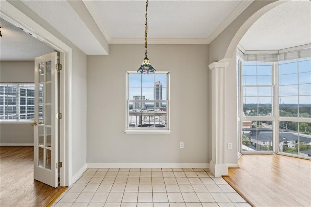 3435 Kingsboro Road Northeast, Unit 1702 Atlanta, GA 30326 - Photo 20 of 35 a view of an empty room with a window