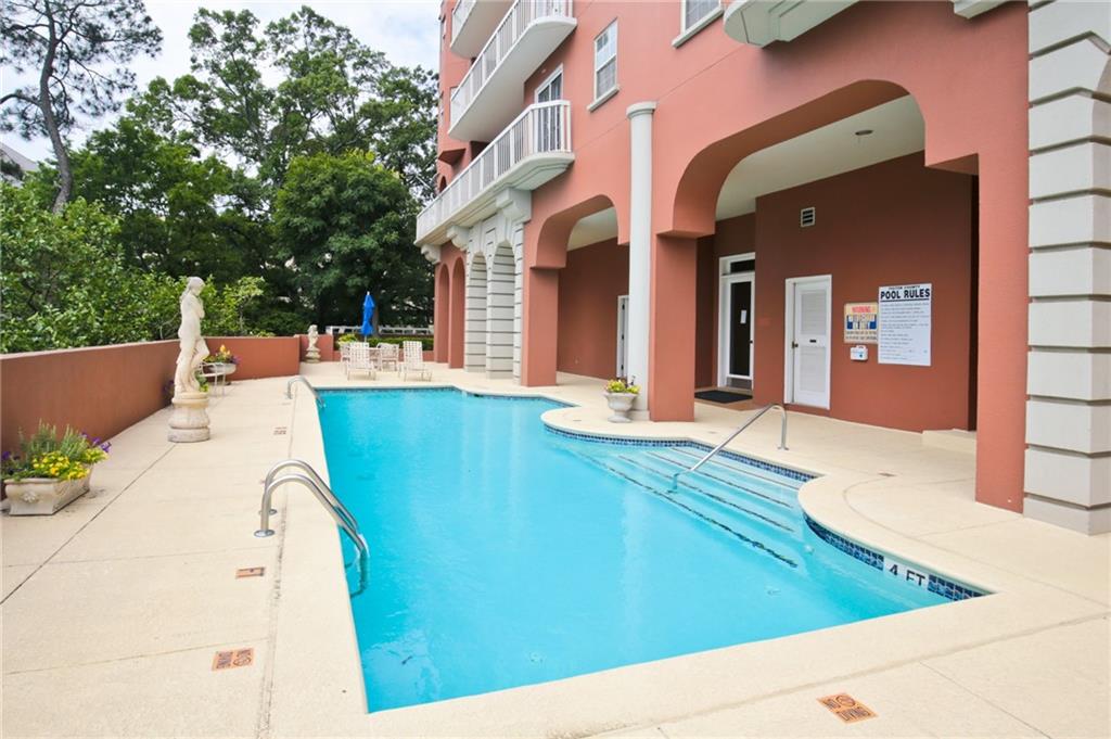 3435 Kingsboro Road Northeast, Unit 1702 Atlanta, GA 30326 - Photo 25 of 35 a view of a house with a backyard