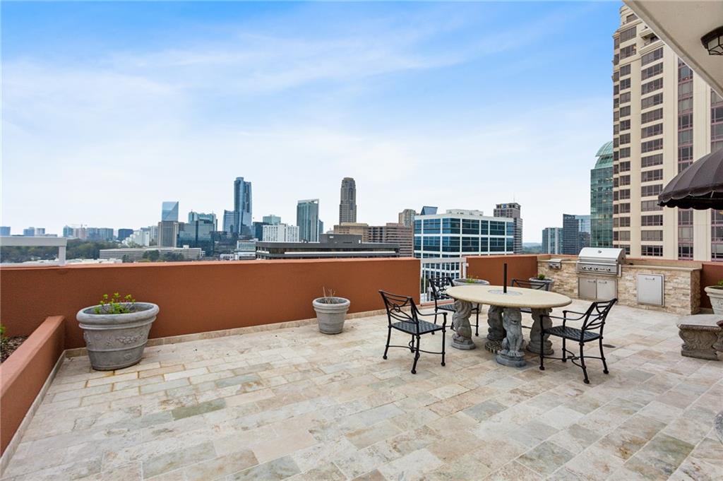 3435 Kingsboro Road Northeast, Unit 1702 Atlanta, GA 30326 - Photo 28 of 35 a view of a terrace with furniture