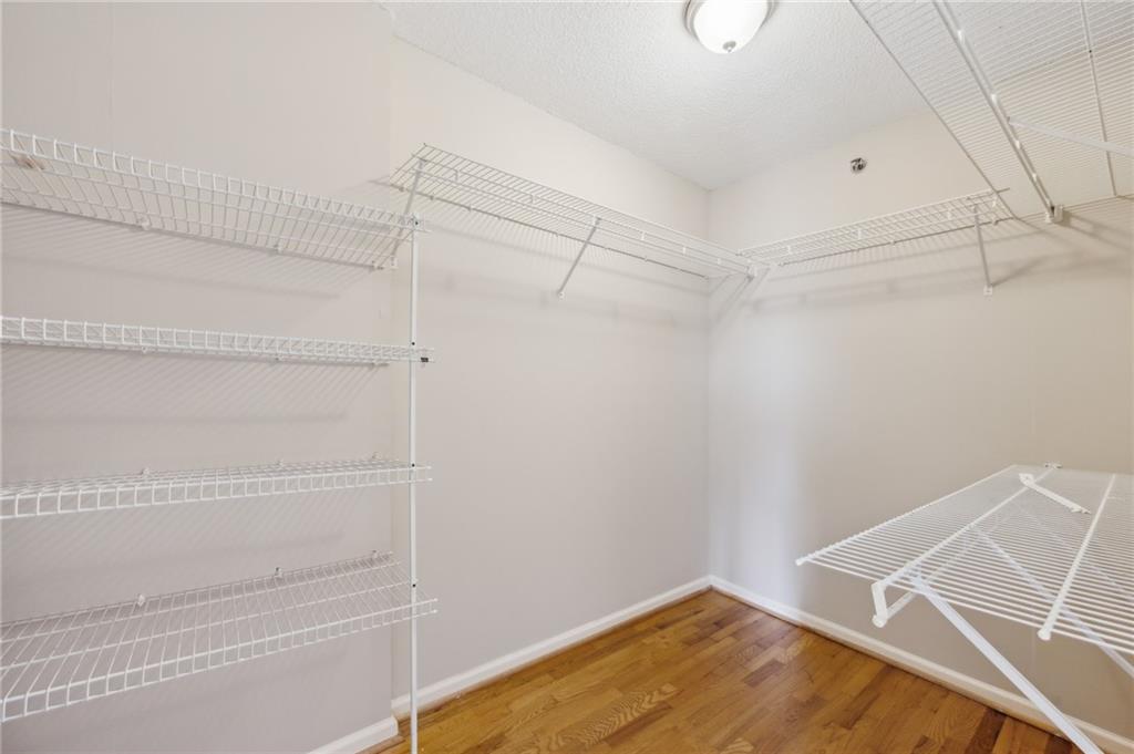3435 Kingsboro Road Northeast, Unit 1702 Atlanta, GA 30326 - Photo 8 of 35 a view of an empty walk in closet