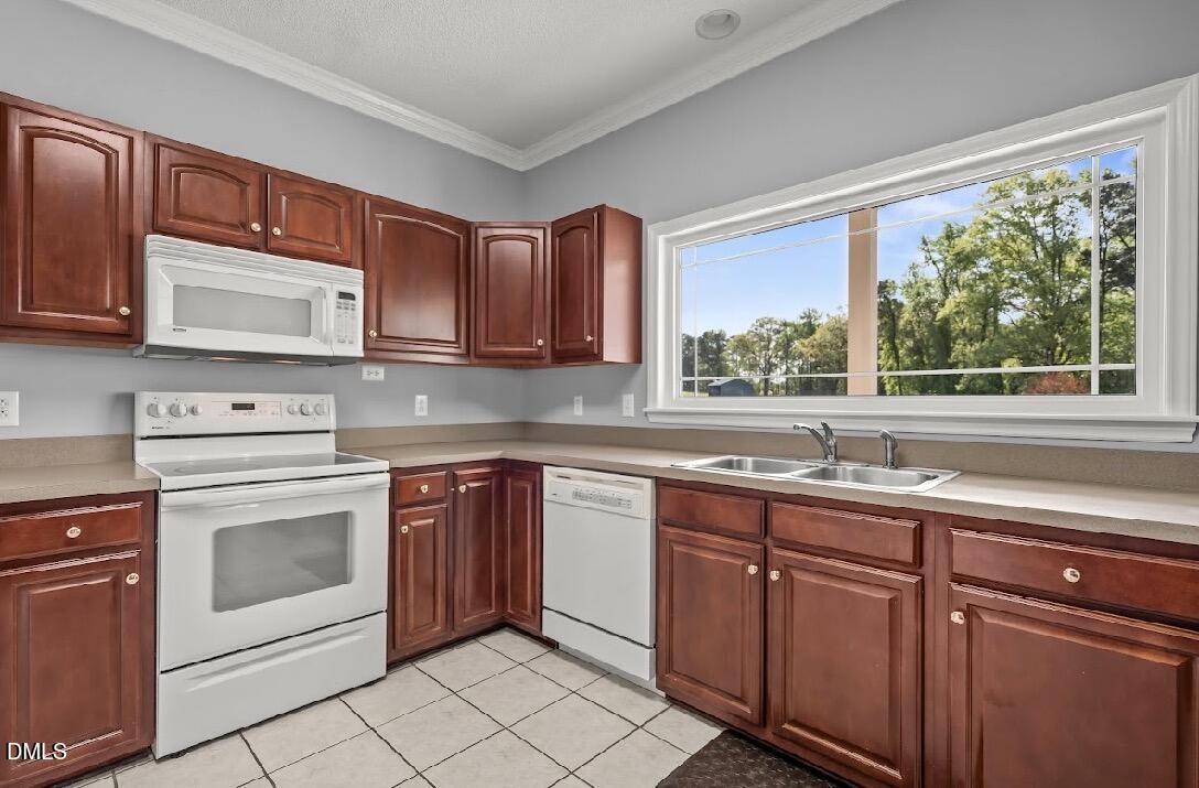 5780 McArthur Road Broadway, NC 27505 - Photo 13 of 40 a kitchen with stainless steel appliances granite countertop a stove sink and cabinets
