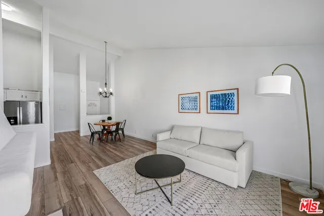 a living room with furniture a fireplace and a table