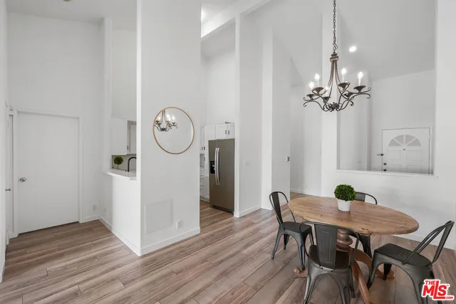 a view of a living room with furniture and a kitchen