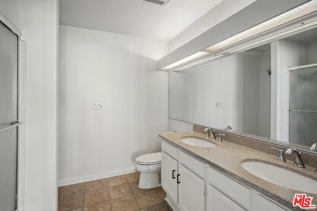 a bathroom with a shower and a shower