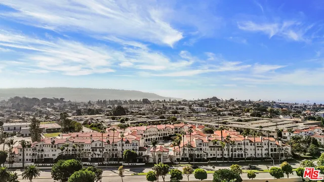 a view of entryway with furniture and front door