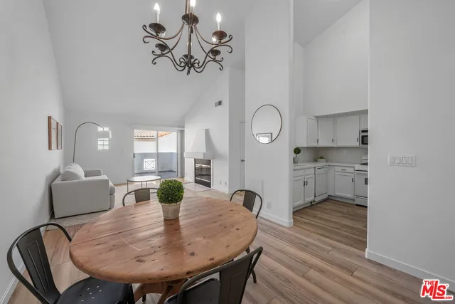 a kitchen with stainless steel appliances a sink cabinets and a refrigerator