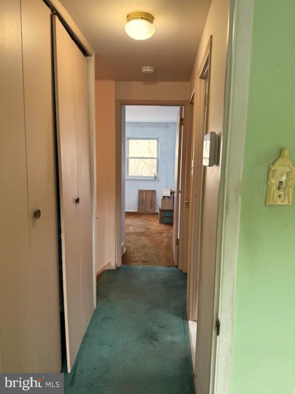12126 Aster Road Philadelphia, PA 19154 - Photo 13 of 32 a view of a hallway with wooden floor and a bathroom