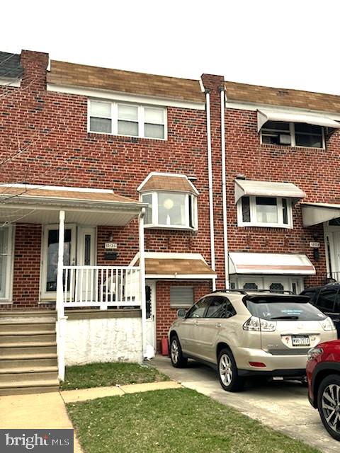 12126 Aster Road Philadelphia, PA 19154 - Photo 2 of 32 a car parked in front of a brick house