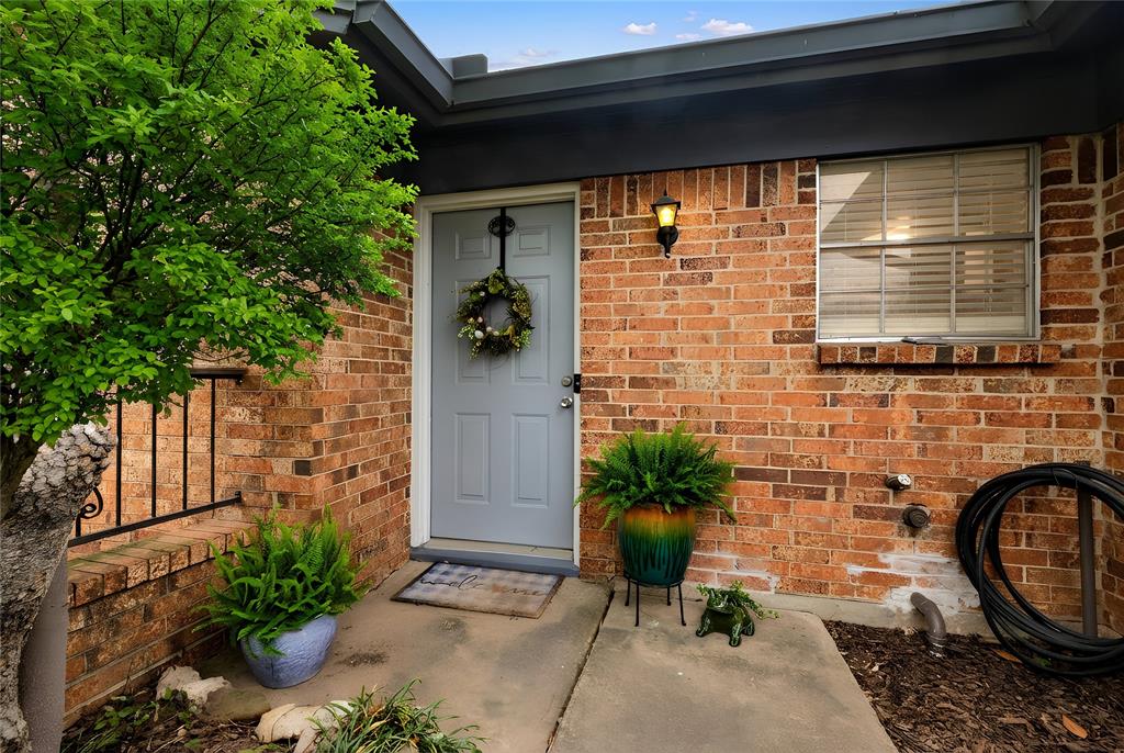 6020 Harrison Way Watauga, TX 76148 - Photo 5 of 32 Property entrance with brick siding
