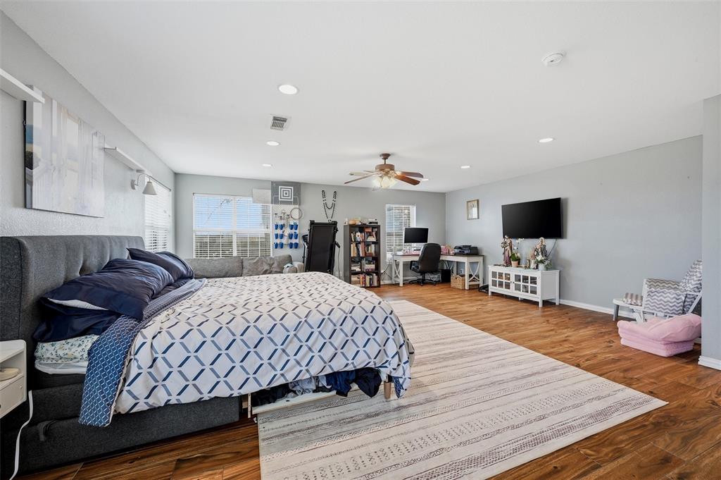 85 Quail Run Road Sherman, TX 75090 - Photo 16 of 31 a bed room with a bed window and a television