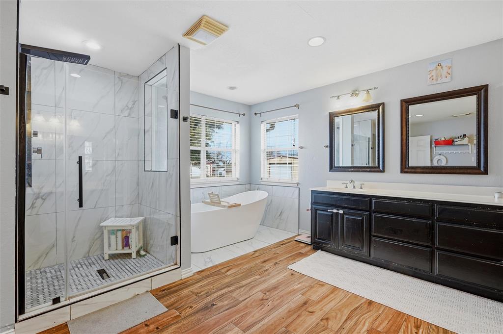 85 Quail Run Road Sherman, TX 75090 - Photo 20 of 31 a spacious bathroom with a shower sink and mirror