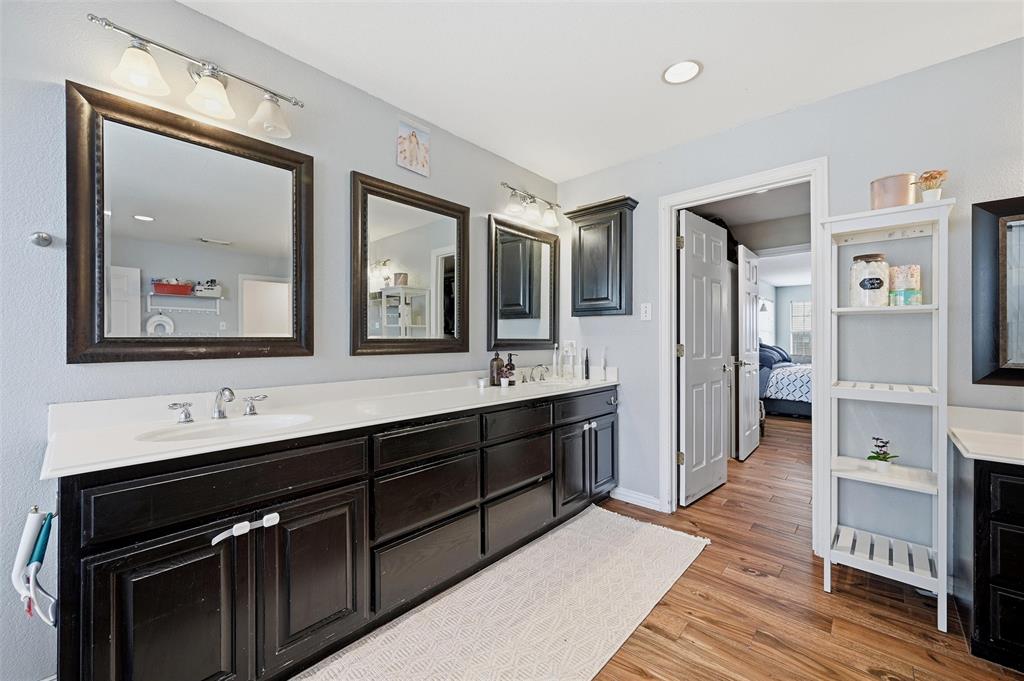 85 Quail Run Road Sherman, TX 75090 - Photo 21 of 31 a spacious bathroom with a sink and a mirror