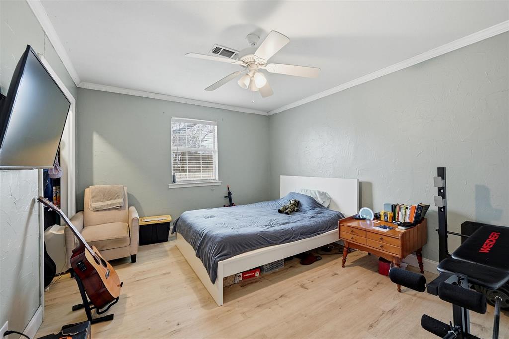85 Quail Run Road Sherman, TX 75090 - Photo 22 of 31 a bedroom with a bed and a window