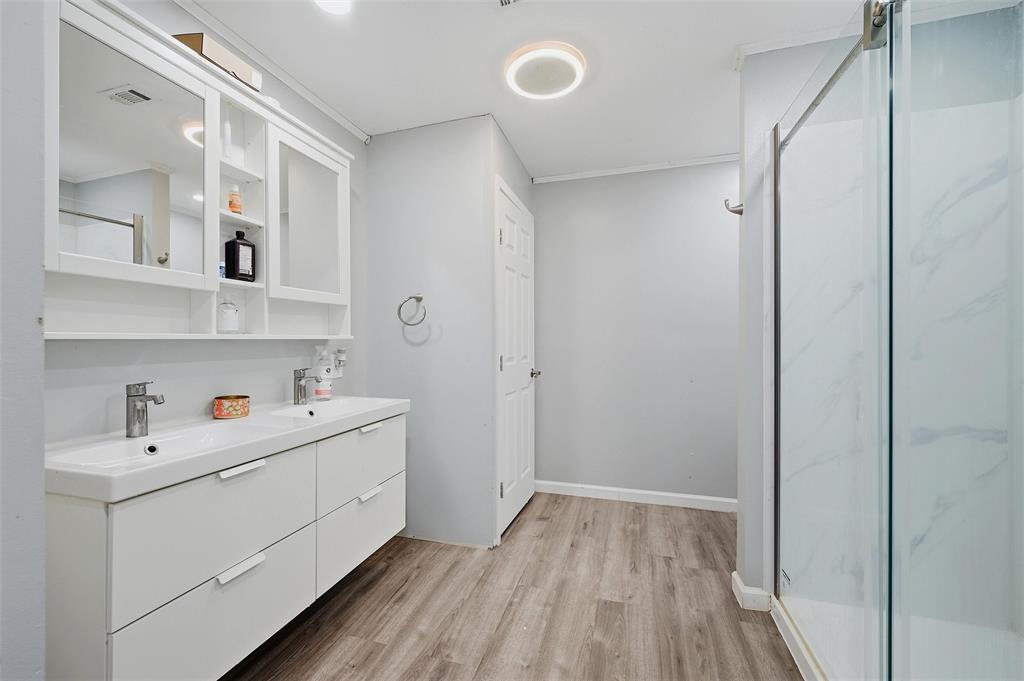 85 Quail Run Road Sherman, TX 75090 - Photo 23 of 31 a room with a sink and wooden floor