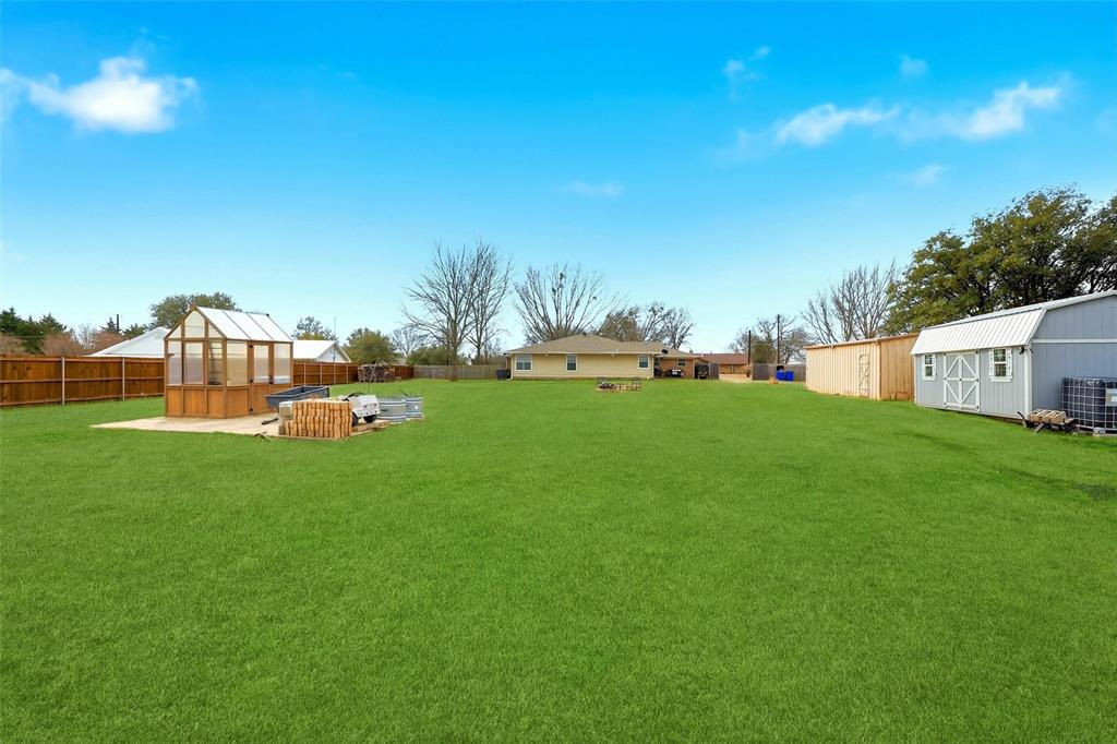 85 Quail Run Road Sherman, TX 75090 - Photo 30 of 31 a backyard of a house with table and chairs