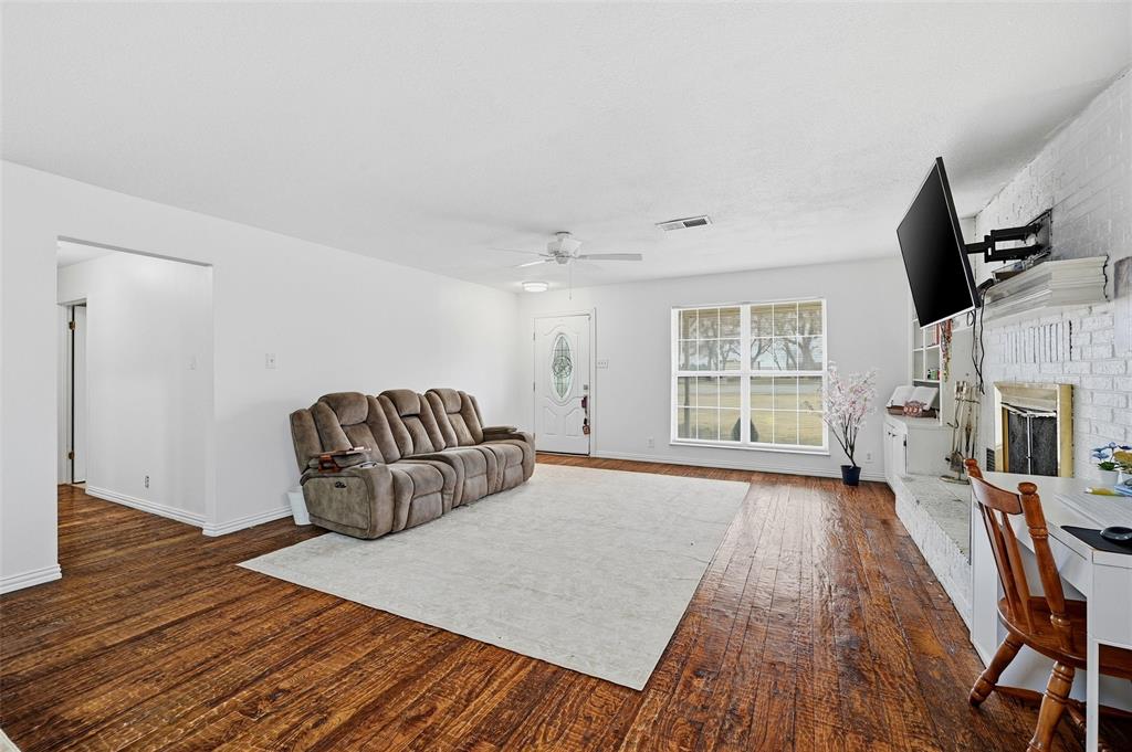 85 Quail Run Road Sherman, TX 75090 - Photo 7 of 31 a living room with furniture fireplace and flat screen tv