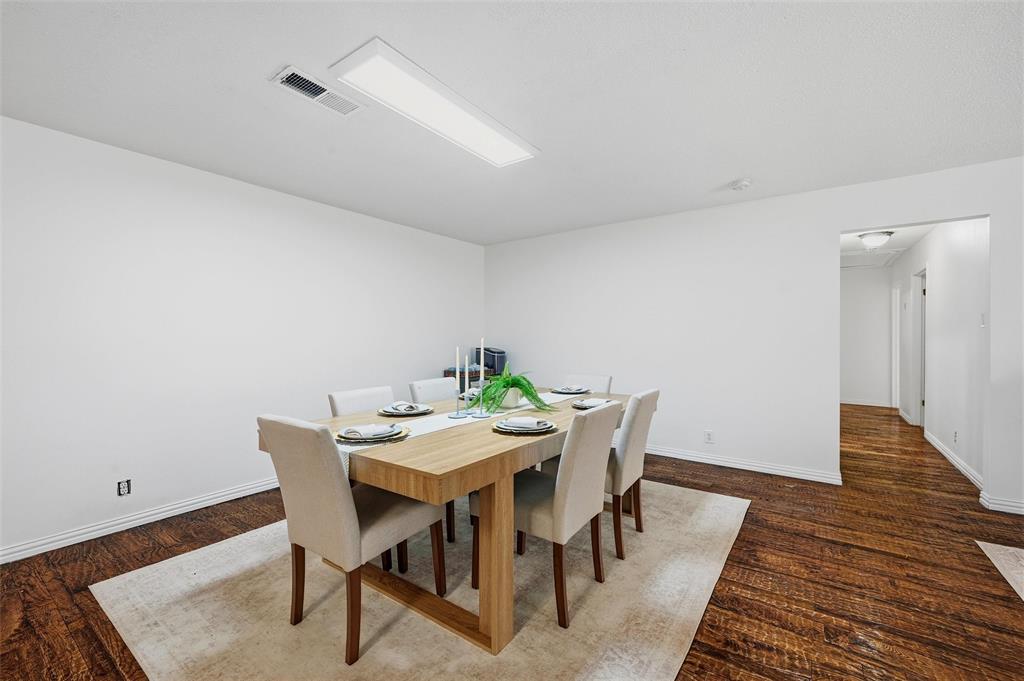 85 Quail Run Road Sherman, TX 75090 - Photo 8 of 31 a view of a dining room with furniture and wooden floor