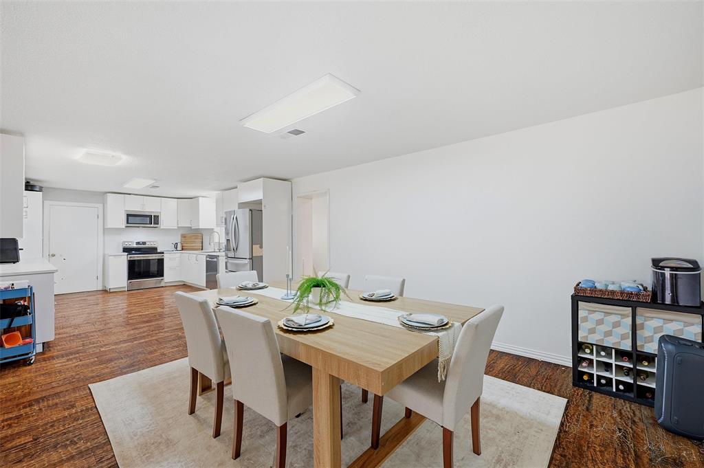 85 Quail Run Road Sherman, TX 75090 - Photo 9 of 31 a view of a dining room with furniture and wooden floor